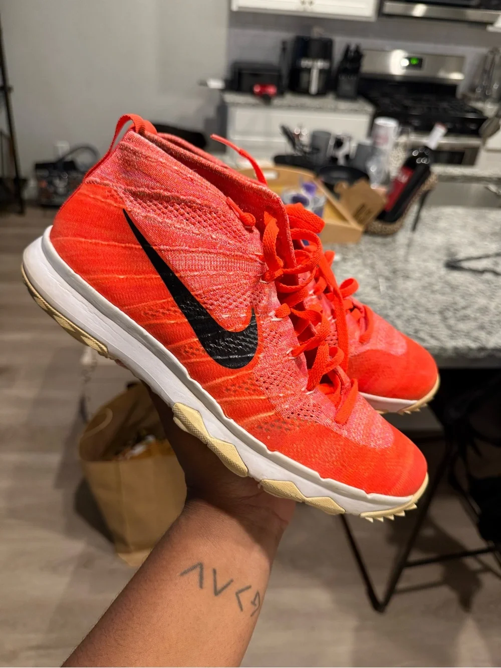 Nike Orange Flyknit Training Sneakers with Black Swoosh